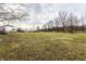This land features a large grass field at 4355 W 450 S, Columbus, IN 47201