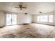 Living room area with hardwood floors, sliding glass doors, and windows at 4355 W 450 S, Columbus, IN 47201