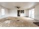 Living room area featuring hardwood floors, glass sliding doors, and doorway at 4355 W 450 S, Columbus, IN 47201