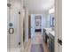 Modern bathroom with glass shower and dual sinks at 4738 E Shadowbrook Dr, Camby, IN 46113