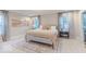 Neutral bedroom with large windows, decor, and plush carpeting at 4738 E Shadowbrook Dr, Camby, IN 46113