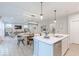 Modern kitchen and living space boasting sleek countertops, stainless steel appliances, and seamless connectivity at 4738 E Shadowbrook Dr, Camby, IN 46113