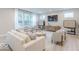 Comfortable living space featuring a cozy sofa, stylish accents, and bright windows offering outdoor views at 4738 E Shadowbrook Dr, Camby, IN 46113