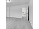 Bright bedroom features neutral carpet, white walls, and an open doorway to the hallway at 4739 E Shadowbrook Dr, Camby, IN 46113