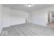 Spacious bedroom with neutral carpet, white walls, and entrance to bathroom at 4739 E Shadowbrook Dr, Camby, IN 46113