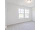 Bright bedroom with carpet and two windows offering ample natural light at 4739 E Shadowbrook Dr, Camby, IN 46113