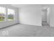 Bright bedroom featuring neutral carpet, white walls, with a double-window and closet allowing ample natural light at 4739 E Shadowbrook Dr, Camby, IN 46113