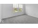 This bedroom features two windows and neutral carpeting at 4739 E Shadowbrook Dr, Camby, IN 46113