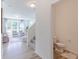 Bright entryway with views into living area, stairs to second floor, and half bathroom at 4739 E Shadowbrook Dr, Camby, IN 46113