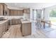 Bright and modern kitchen with stainless steel appliances, lots of cabinets, and an adjacent dining area at 4739 E Shadowbrook Dr, Camby, IN 46113