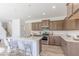 Modern kitchen with stainless steel appliances, a breakfast bar, and sleek countertops at 4739 E Shadowbrook Dr, Camby, IN 46113