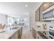 Bright kitchen featuring stainless steel appliances, modern countertops, and lots of storage at 4739 E Shadowbrook Dr, Camby, IN 46113