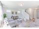 Well-lit living room featuring neutral furniture and hardwood-style floors at 4739 E Shadowbrook Dr, Camby, IN 46113