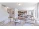 Open-concept living room flowing into kitchen and dining areas at 4739 E Shadowbrook Dr, Camby, IN 46113