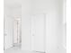 Bright bedroom featuring crisp white walls, trim, neutral carpet and minimalist decor at 5771 Cr W 750 N, McCordsville, IN 46055