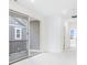 Bright hallway with large sliding glass door leading to a balcony, offering indoor-outdoor living at 5771 Cr W 750 N, McCordsville, IN 46055