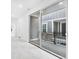 Bright hallway with sliding glass door leading to a balcony, offering indoor-outdoor living at 5771 Cr W 750 N, McCordsville, IN 46055