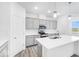 Bright kitchen featuring an island, gray cabinets, and stainless appliances at 5771 Cr W 750 N, McCordsville, IN 46055