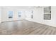 Bright, empty living room with gleaming floors and white walls, ready for customization at 5771 Cr W 750 N, McCordsville, IN 46055