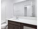 Modern bathroom featuring a large mirror, vanity with storage, and white countertop at 5777 Cr W 750 N, McCordsville, IN 46055