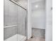 Bathroom showcasing a tiled shower with glass door and walk-in closet at 5777 Cr W 750 N, McCordsville, IN 46055