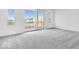Bright, carpeted bedroom with a sliding glass door to the balcony at 5777 Cr W 750 N, McCordsville, IN 46055