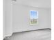 Bright bedroom with neutral carpet, white walls, and a window showcasing the outdoor view at 5777 Cr W 750 N, McCordsville, IN 46055