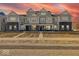 Townhome exteriors feature multiple units, brick facades, and walkways leading to front doors at 5777 Cr W 750 N, McCordsville, IN 46055