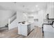 Well-lit kitchen featuring an island, stainless steel appliances, and white cabinets at 5777 Cr W 750 N, McCordsville, IN 46055