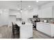 Modern kitchen featuring white cabinetry, an island with seating, and stainless appliances at 5777 Cr W 750 N, McCordsville, IN 46055