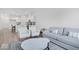 Bright living room featuring plush seating, and an adjacent modern kitchen at 5777 Cr W 750 N, McCordsville, IN 46055