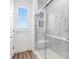 Bathroom featuring glass enclosed shower and a large window for natural light at 5785 Cr W 750 N, McCordsville, IN 46055