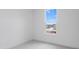 Bedroom featuring a large window with a view of a residential neighborhood at 5785 Cr W 750 N, McCordsville, IN 46055