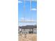 An exterior shot of a multi-story home seen from a window with an exposed wooden frame and a clear blue sky at 5785 Cr W 750 N, McCordsville, IN 46055