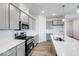 Spacious kitchen featuring a large island with sink, stainless steel appliances, and ample gray cabinetry at 5785 Cr W 750 N, McCordsville, IN 46055