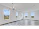 Sun-filled living room with expansive windows, recessed lighting, and sleek, modern flooring at 5785 Cr W 750 N, McCordsville, IN 46055