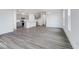 Open-concept living space featuring a modern kitchen with island and views into the light-filled living room at 5785 Cr W 750 N, McCordsville, IN 46055