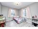 Cozy bedroom with new windows, luxury vinyl plank flooring, and soft gray walls at 5984 Williams Dr, Plainfield, IN 46168