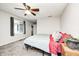 Well-lit bedroom with neutral walls, soft carpet, and a large window offering ample natural light at 5984 Williams Dr, Plainfield, IN 46168