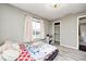 Bedroom with new flooring, neutral paint, a window, and a walk-in closet at 5984 Williams Dr, Plainfield, IN 46168
