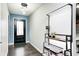 Bright entryway boasting dark hardwood flooring and a modern light fixture at 5984 Williams Dr, Plainfield, IN 46168