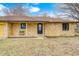 Inviting stone home featuring a covered porch and a black front door, ready for new owners at 5984 Williams Dr, Plainfield, IN 46168