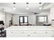 Eat-in kitchen with island and modern fixtures, with open access to the breakfast nook and Gathering room at 5984 Williams Dr, Plainfield, IN 46168