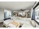Open-concept living room featuring a large sectional couch with a window overlooking the yard at 5984 Williams Dr, Plainfield, IN 46168