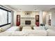 Cozy living room featuring a stone fireplace and comfortable seating with views of the backyard at 5984 Williams Dr, Plainfield, IN 46168