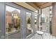 Condo balcony showcasing outdoor seating, a sliding glass door, and views of the surrounding condo buildings at 622 E 10Th St # 206, Indianapolis, IN 46202
