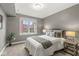 Neutral bedroom boasts soft gray walls, a comfortable bed, and a window view at 622 E 10Th St # 206, Indianapolis, IN 46202