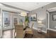 Cozy dining area features a glass table, four woven chairs, and doors to the outside balcony at 622 E 10Th St # 206, Indianapolis, IN 46202