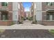 Colorful condo building featuring a well-maintained walkway and manicured landscaping, creating an inviting entrance at 622 E 10Th St # 206, Indianapolis, IN 46202
