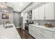 Well-equipped kitchen boasting stainless steel appliances, white cabinets, and modern countertops at 622 E 10Th St # 206, Indianapolis, IN 46202